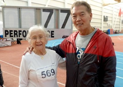 Olga and Harold pose with her WR indoor high jump for W90.