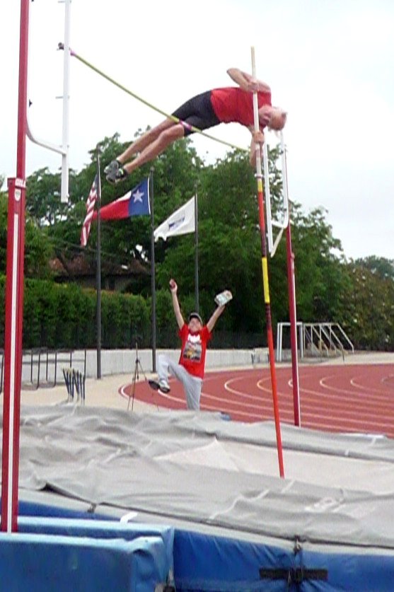 Bax Berle, 15, celebrates as Don clears 3.20 WR; Bax is son of vaulter Dolf Berle.