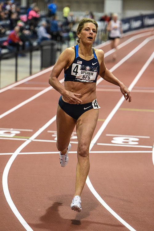 W55 Joy Upshaw sets AR in 200 — her third record of the meet.