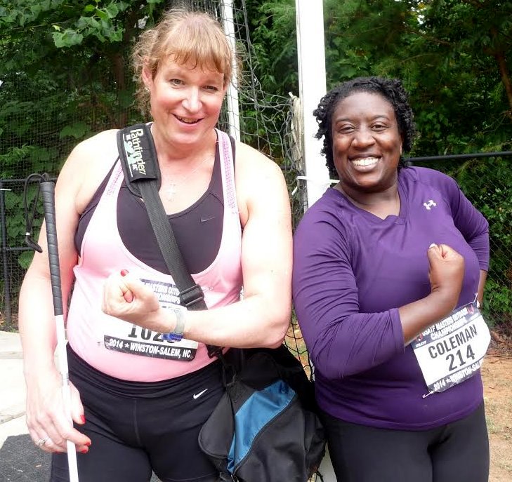 Mistresses of the (Throwing) Universe: Stephanie Timmer (left) and Marilyn Coleman compare muscle development. Photo by Linda Swenson