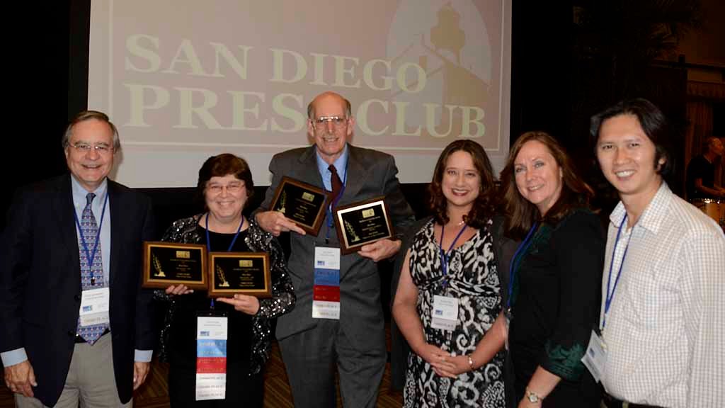 Chris and me stand between Chris Jennewein and colleagues Jennifer Vigil and Chris Huard at press awards.