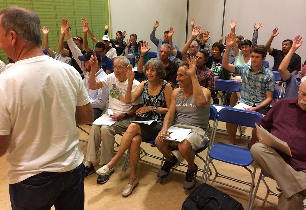 Paul Greer (left) helps conduct elections at San Diego USATF meeting.