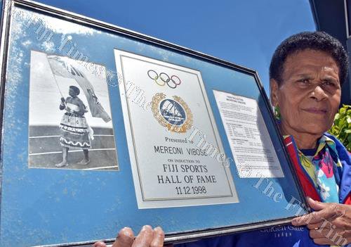 Mereoni Vibose is shown with some of her old awards. She'll seek new ones in October.
